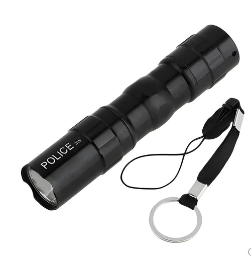 Black aluminium mini LED flashlight on a table showing its 9.5 cm length and 2 cm diameter.