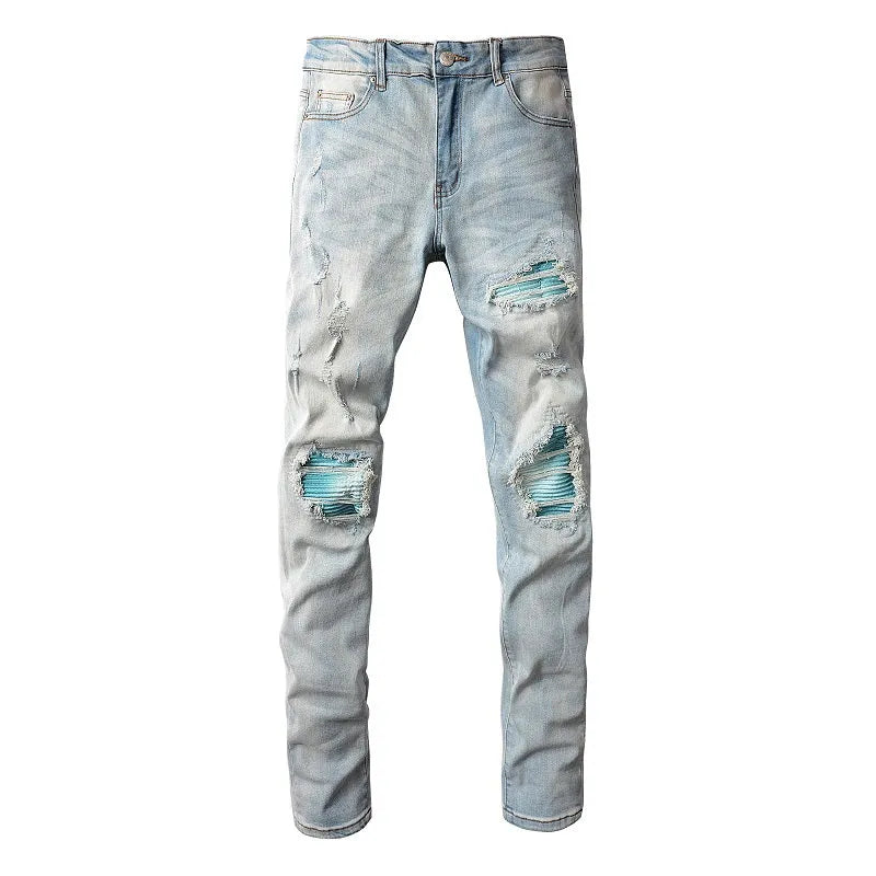 Men's light blue distressed slim fit jeans with five pocket patchwork, enzyme washed, side view