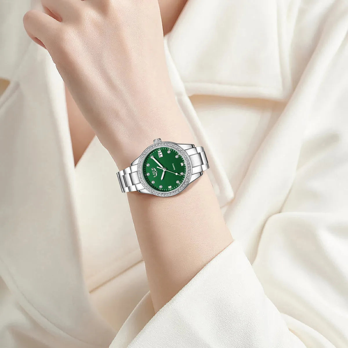 Women's silver fashion watch with diamond-encrusted bezel and luminous hands on 34mm stainless steel case