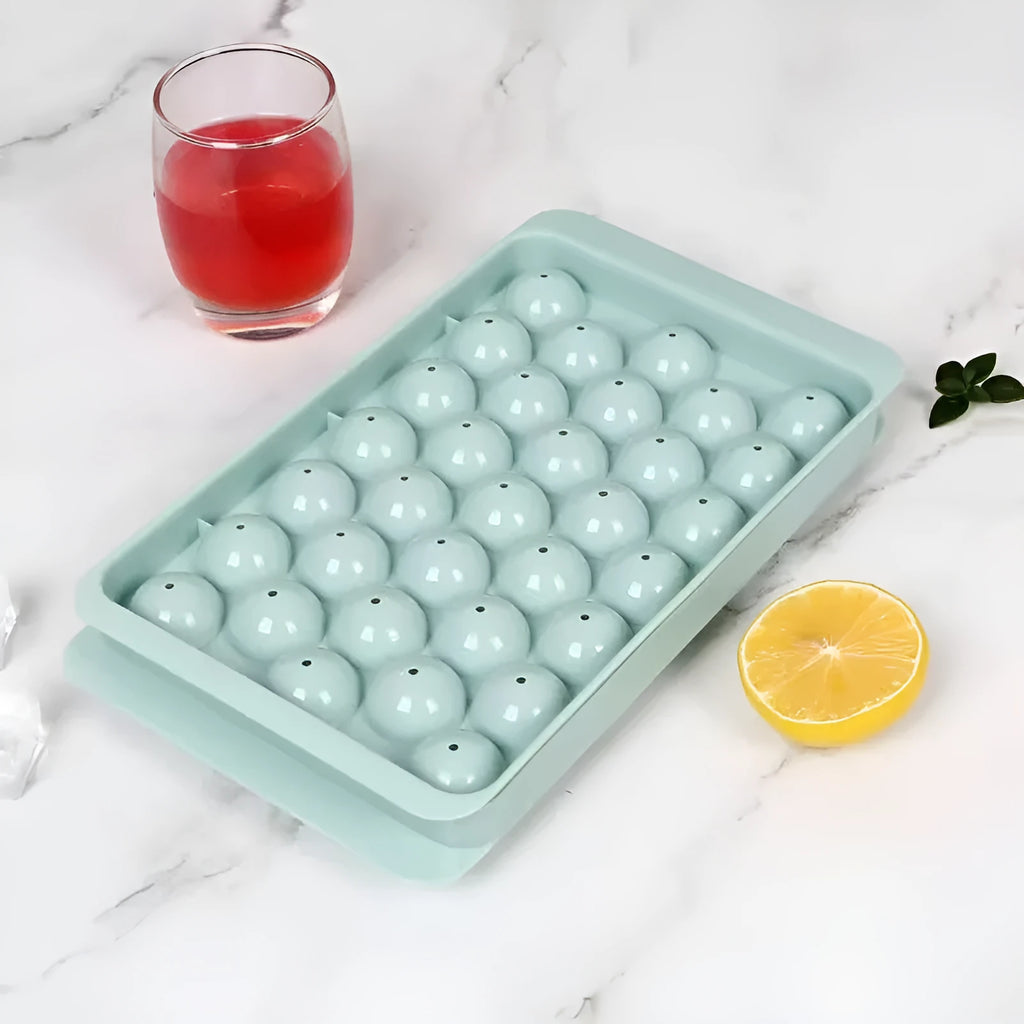 Round blue silicone ice cube tray with lid showing 33 compartments