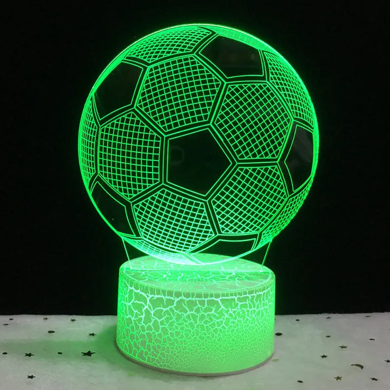 3D football-shaped night light showing multicolour illumination on acrylic surface