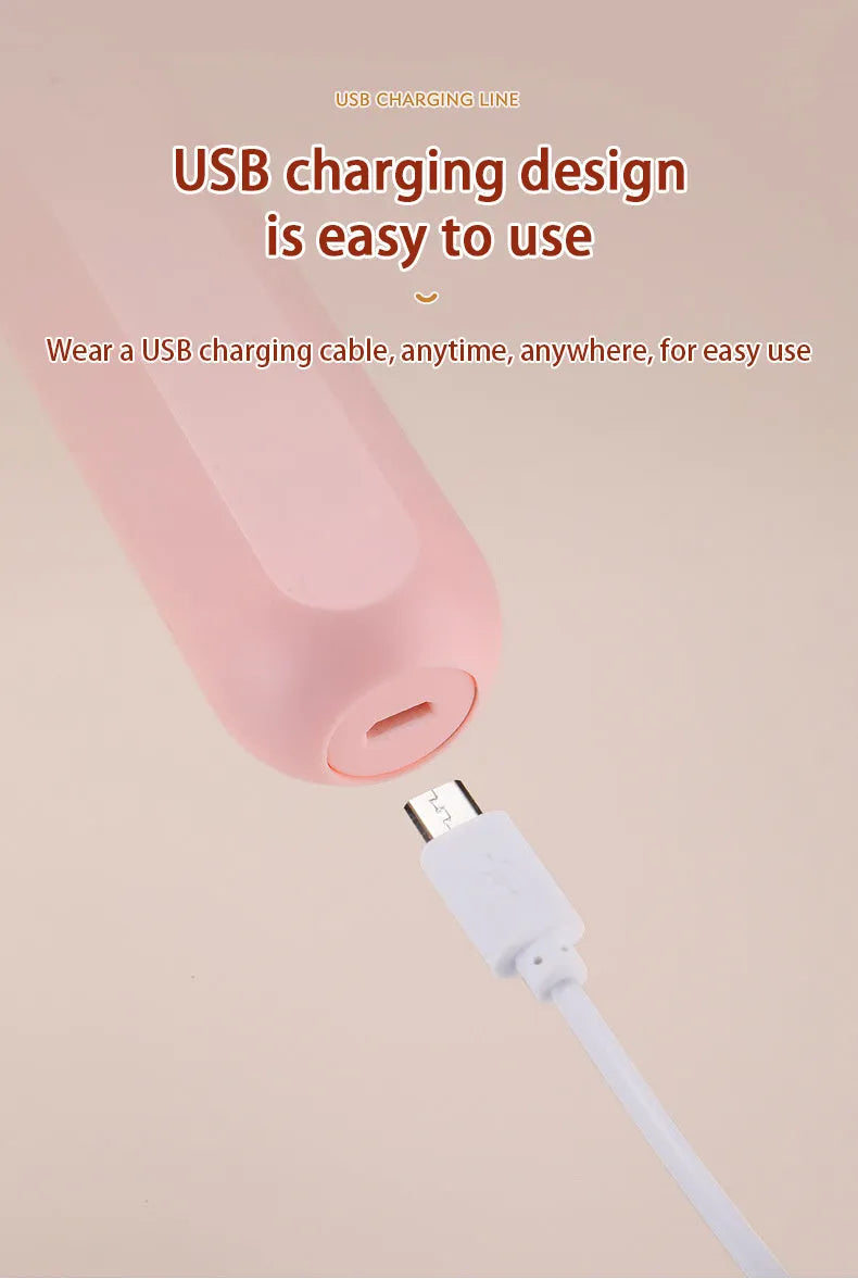 Hand-held wireless electric whisk in black and pink, with straight handle and stainless steel whisk attachment