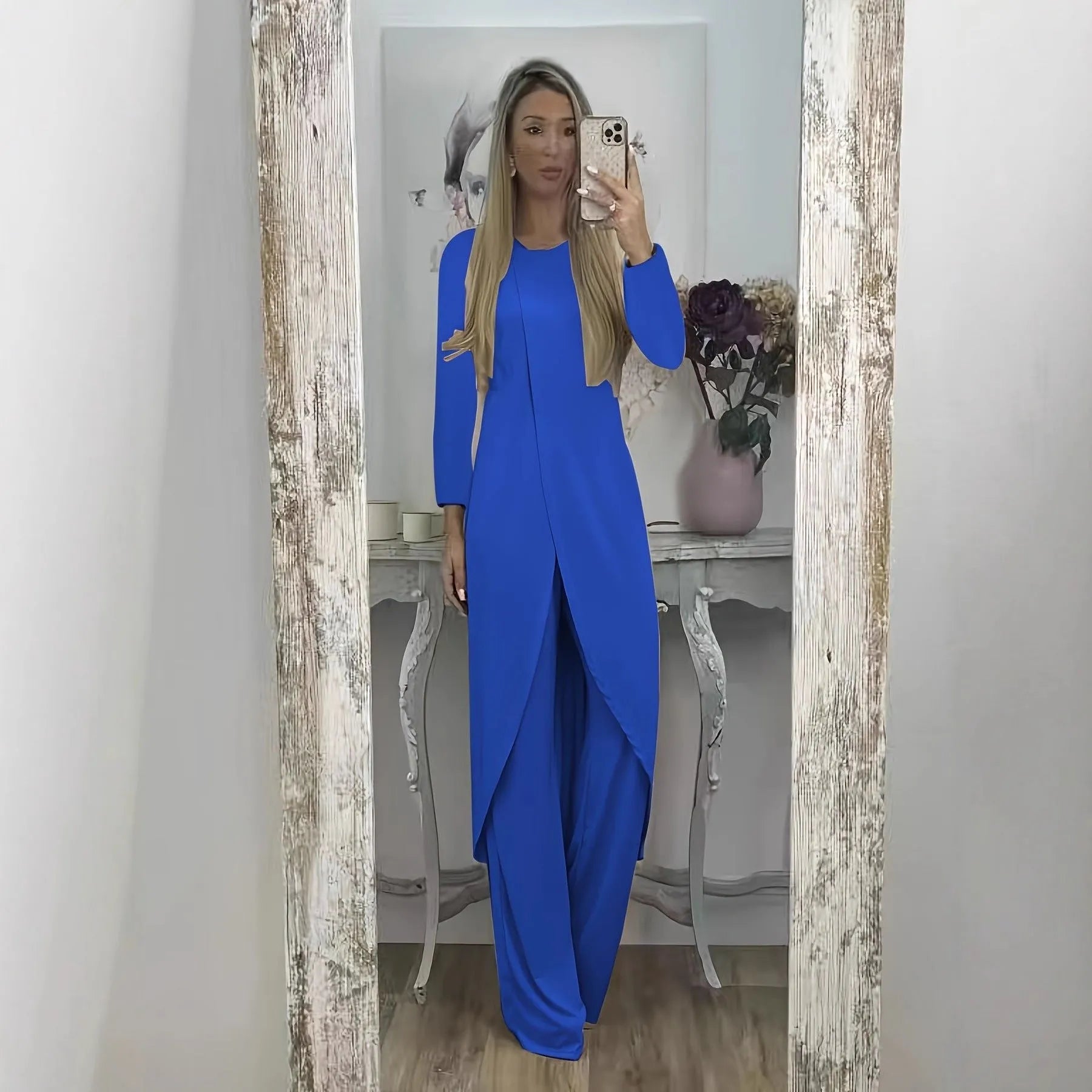 Black loose fit casual two-piece lounge set with long sleeve top and trousers on a hanger.