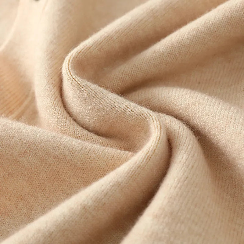 Man wearing a beige Andy velvet V-neck knitted cardigan coat with long sleeves.
