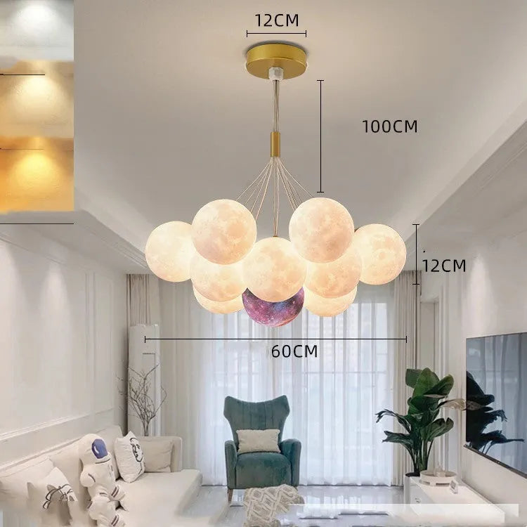 Nordic fish chandelier with moon bubble design in gold or black colours, showing iron body and PMMA lampshades