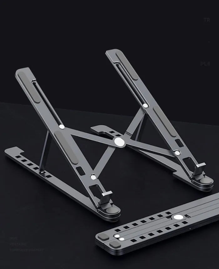 A folded and unfolded aluminium laptop stand in silver, shown next to a laptop.