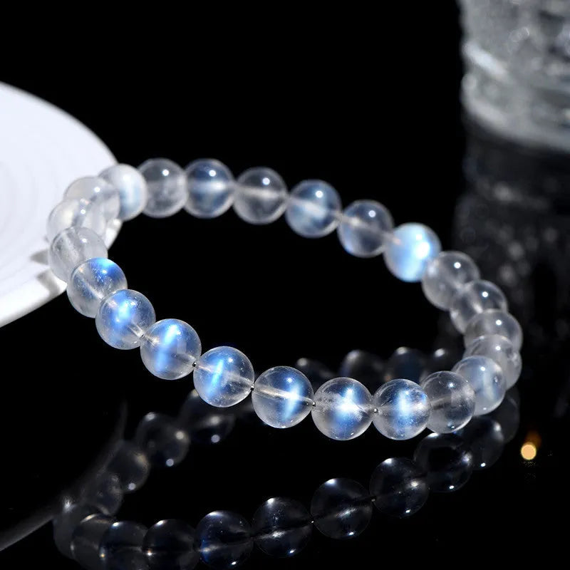 Natural cream coloured crystal bracelet with smooth ground beads, shown in a minimalist unisex style.