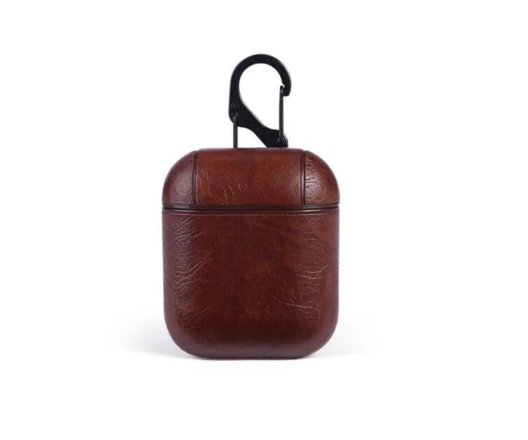 Genuine leather protective pouch for Apple Airpods charging case in black, brown, light brown, and red colours.