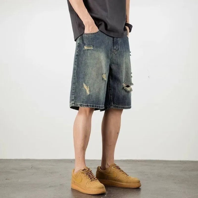 Men's blue retro loose hole denim shorts with straight leg fit