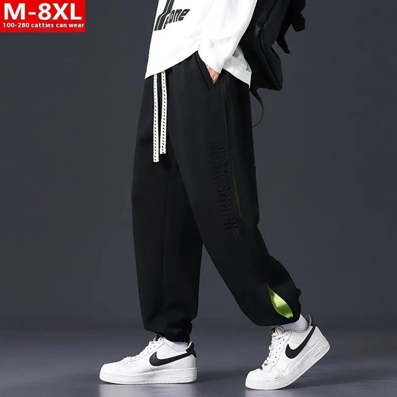 Men's loose-fit cotton trousers with ankle banded design in grey green colour