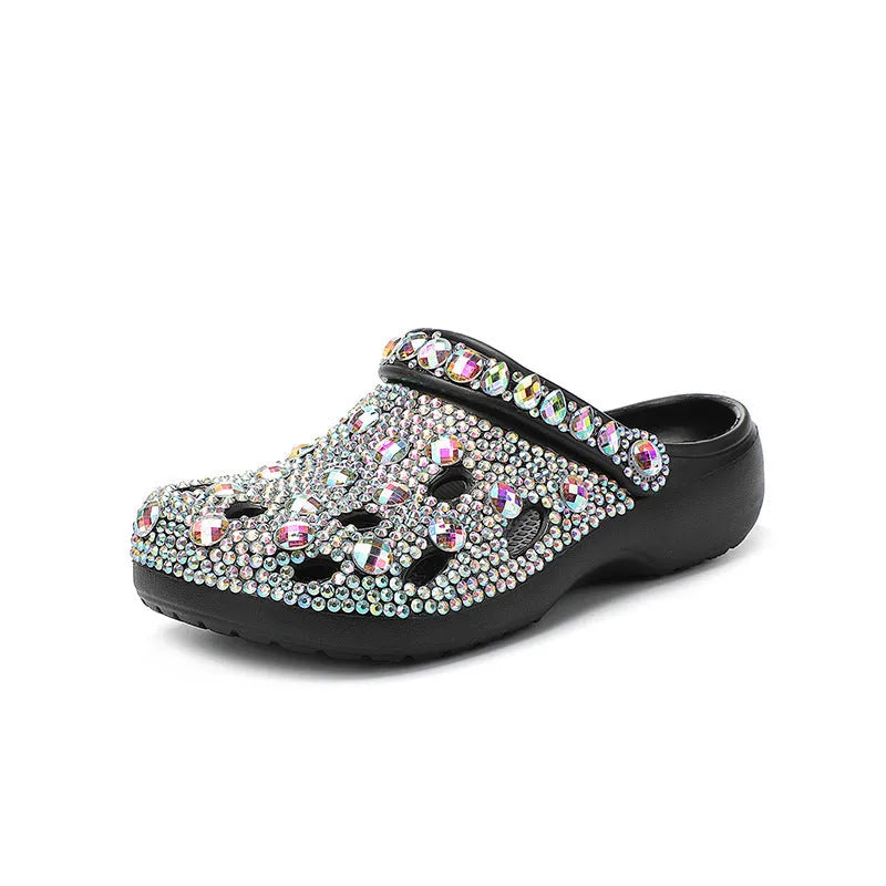 Black women's platform sandals with rhinestone decoration and hole shoe design on an EVA sole.