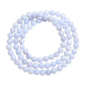 Blue agate bracelet with scattered multi-circle stripes and Ruyi design on wrist.