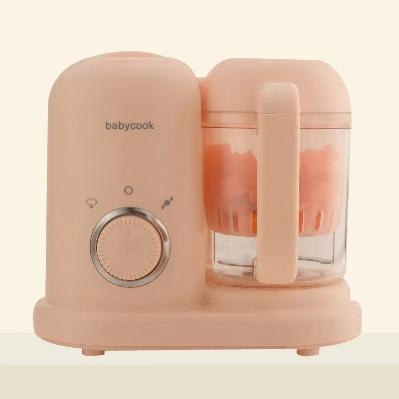 Green and pink baby food processor with steamer and blender functions, showing double mixing blades.