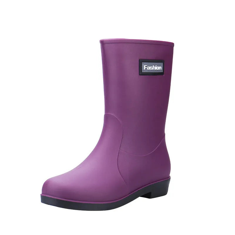 Women's mid-calf rain boot in PVC, low heel, shown in black colour.