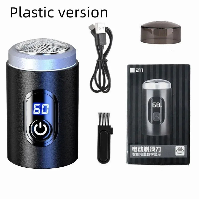 Black mini portable electric shaver with USB cable and cleaning brush on a white background.