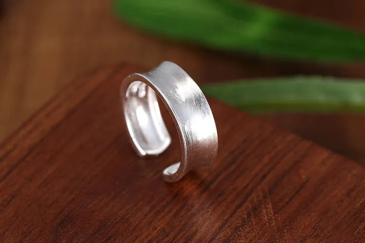 Adjustable opening geometric frosted sterling silver ring with open design
