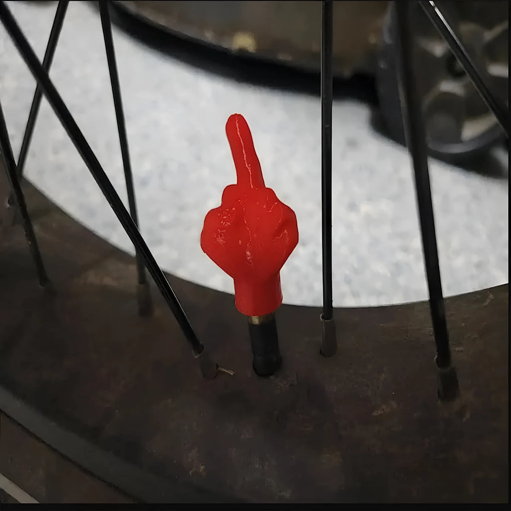 Four latex tyre valve caps showing black and skin colour options for vehicle dust protection