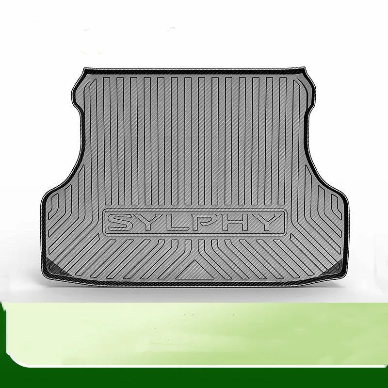 Black carbon fibre pattern TPE car trunk protector mat lying flat.