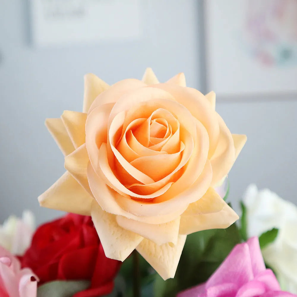 Artificial silk rose flower with red petals and green plastic stem measuring approximately 42cm long