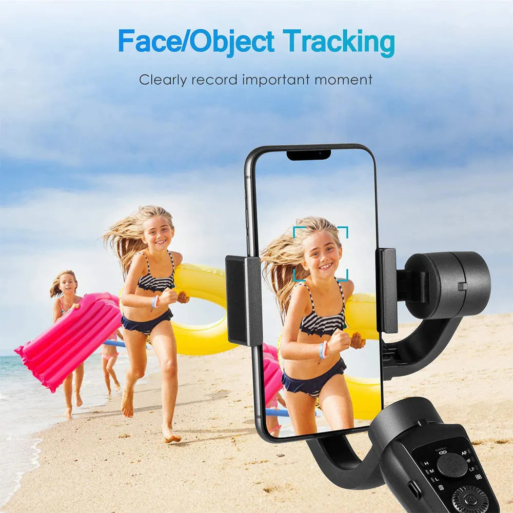 Black three-axis phone gimbal stabilizer with tripod accessory on table