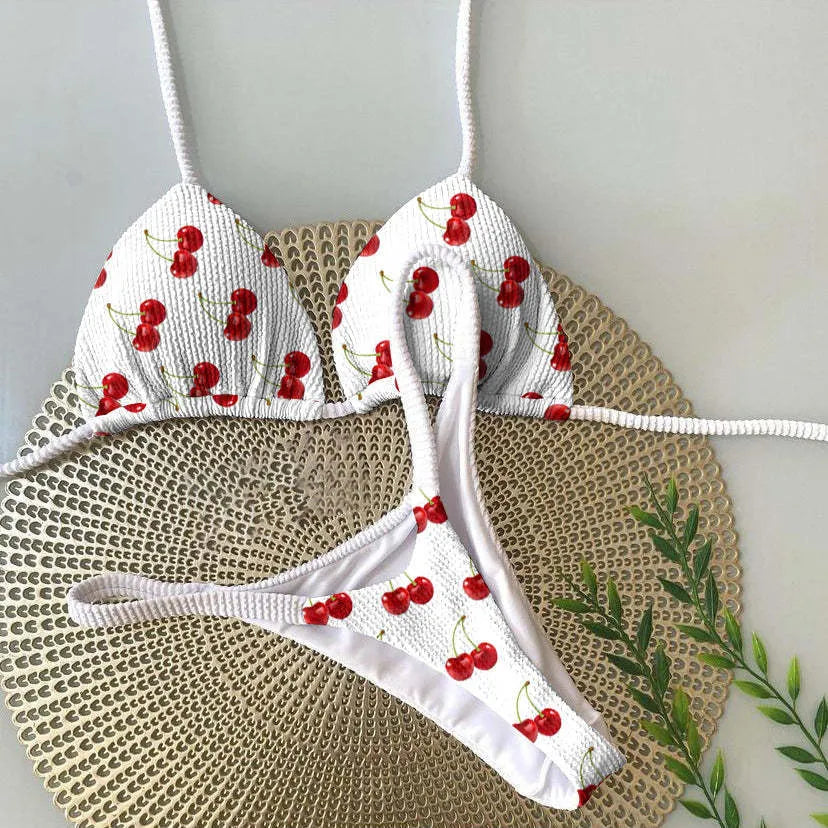 Women's briefs-style bikini swimsuit in a printed pattern, made from nylon with a cotton lining.