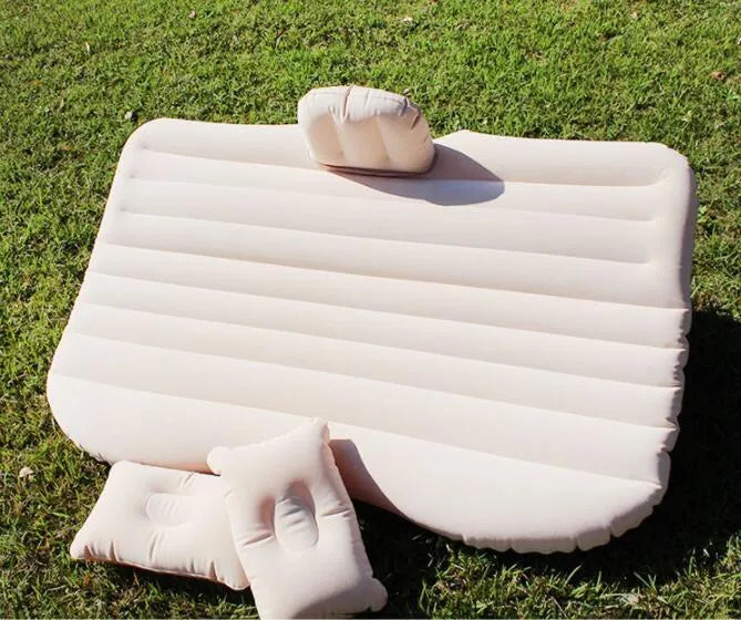 Universal inflatable car bed with flocking material, shown with pump, pillows, and storage bag.