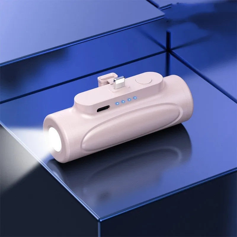 Black and pink portable power bank with integrated LED flashlight, showing Type-C and Apple port options.