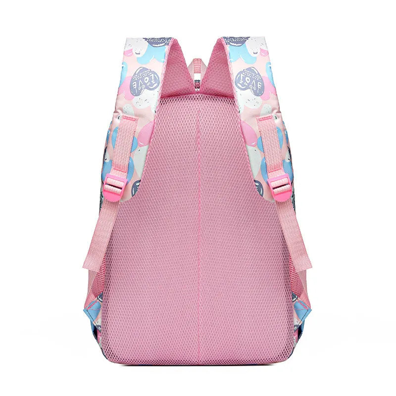 Blue children's school backpack with air pillow straps on a grey background.