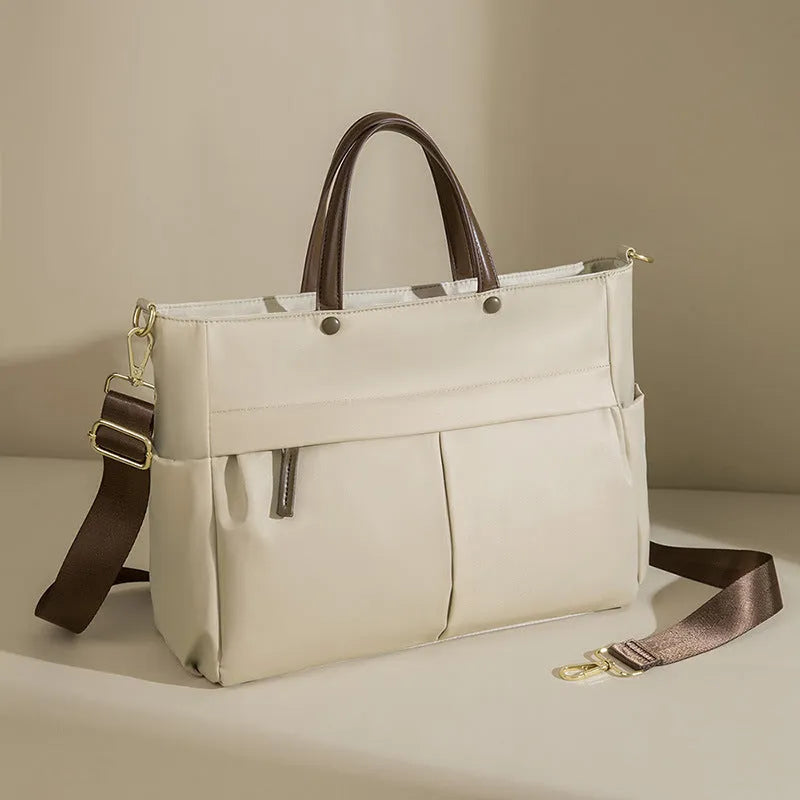 Women's Oxford cloth laptop bag in elegant black or nuts and apricots colours with contrast stitching