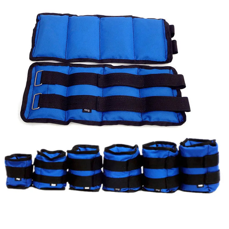 A pair of black Oxford cloth legging sandbags with straps, shown with weight options from 1kg to 6kg for athletic training.