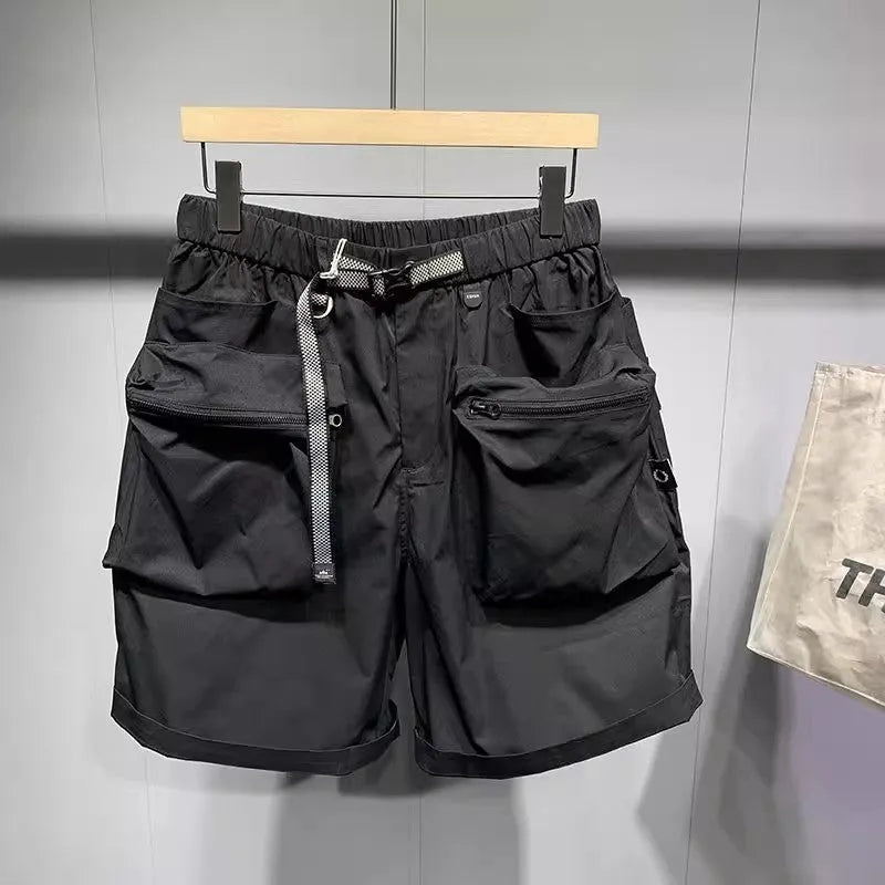 Men's black loose fit work shorts with pockets and straight leg hem above knee length