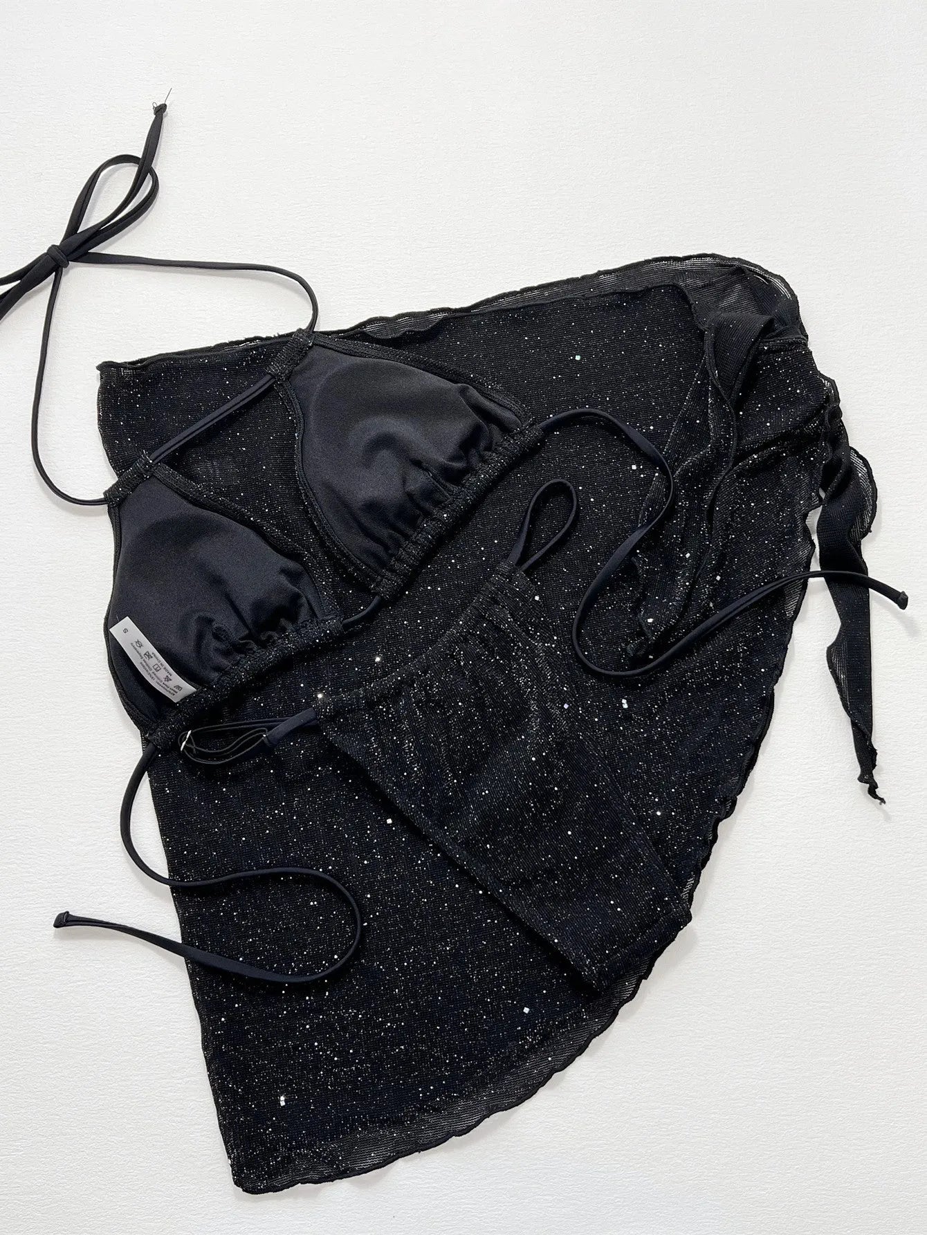Black three-piece bikini swimsuit set with polyester fabric top and matching shorts