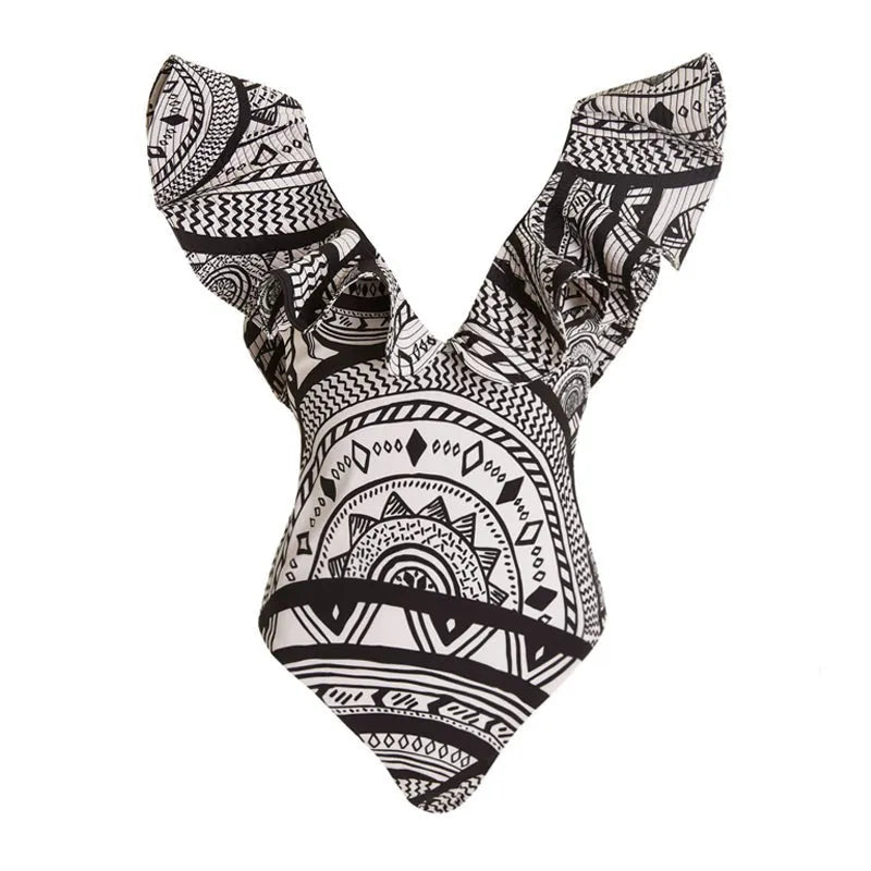 Women's deep V-neck vintage print one-piece swimsuit with matching wrap skirt on hanger.