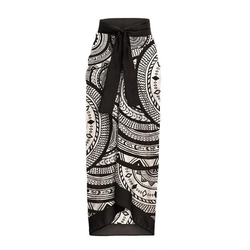 Women's deep V-neck vintage print one-piece swimsuit with matching wrap skirt on hanger.