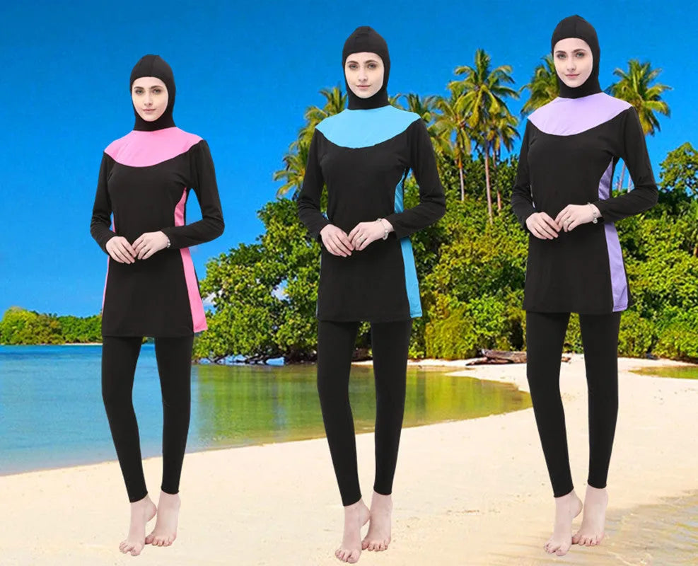 Conservative women's hooded long sleeve swimsuit in black with colour trim.