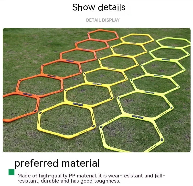 Set of six foldable yellow green and orange hexagon football agility training rings on grass
