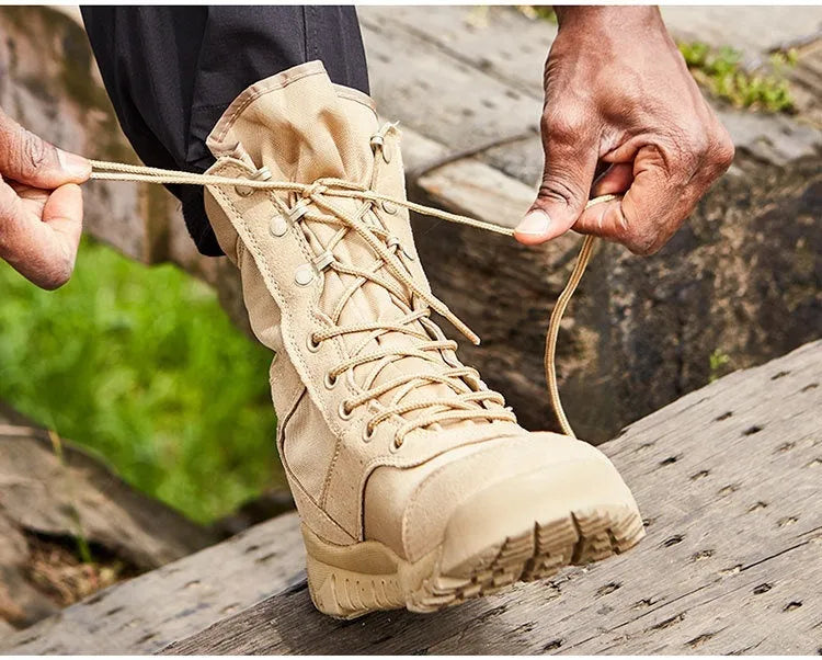 Yulong combat tactical desert boots in black and sand colour on a rocky outdoor background.