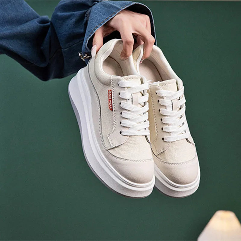 Beige and pink women's leather board shoes with thick soles shown from the side.