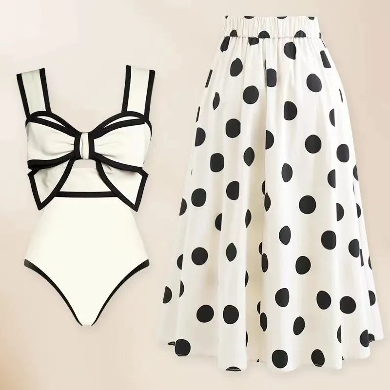 Women's black one-piece swimsuit with white round skirt and bow decoration for beach swimming