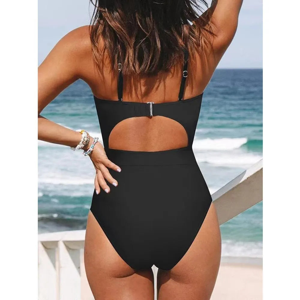 Women's black cross-back one-piece swimsuit with backless design