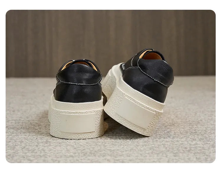 Women's black platform sports board shoes with embossed cowhide upper and lace-up closure