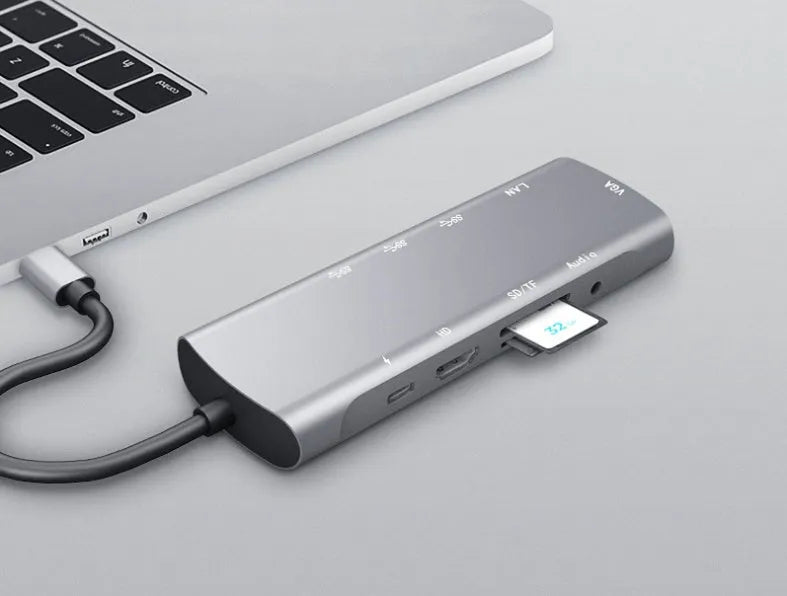Grey aluminium USB-C docking station with HDMI, VGA, USB port, and a 140mm cable.