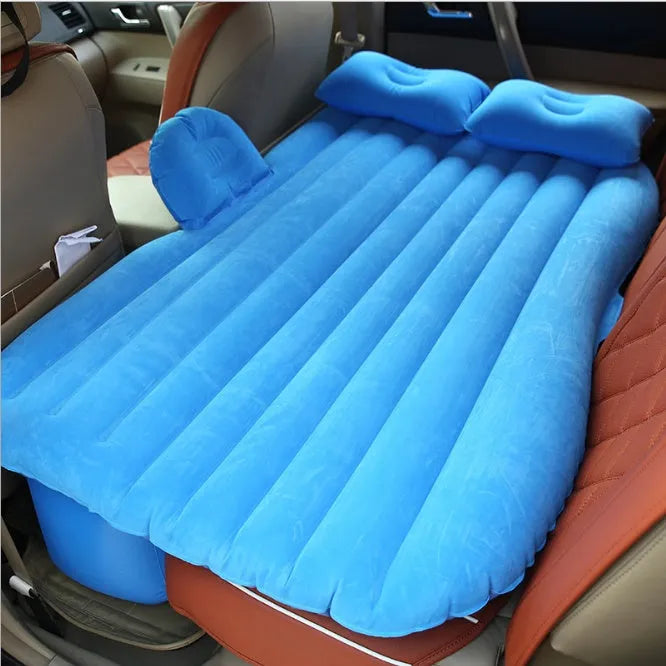 Universal inflatable car bed with flocking material, shown with pump, pillows, and storage bag.