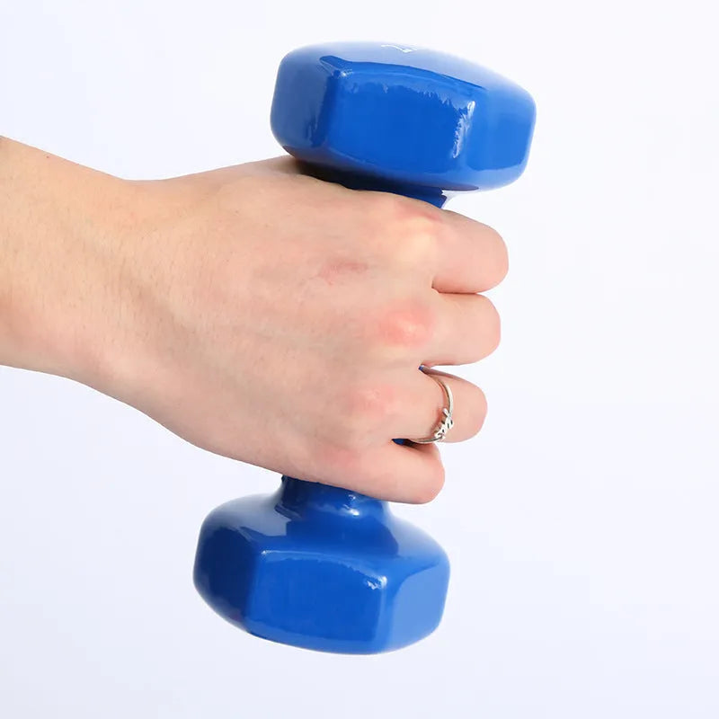 Bright colour plastic fitness dumbbells in random colours showing glossy surface finish for home exercise