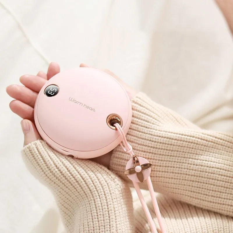 Green, pink or white portable power bank with digital display and integrated hand warmer function