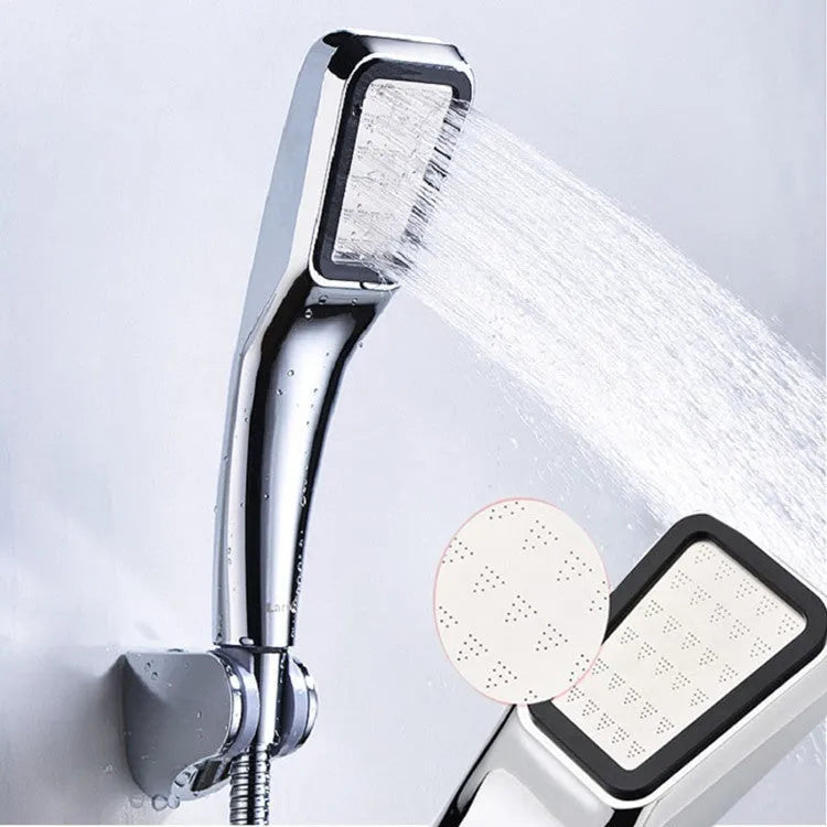 Hand-held pressurised rain shower head in orange and seven set configurations