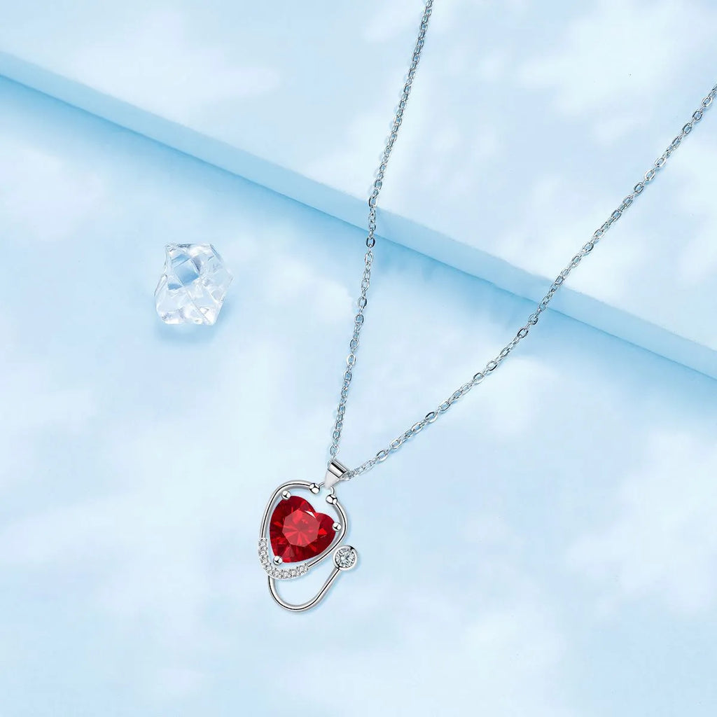 Women's copper necklace with a stethoscope pendant in a red diamond colour.