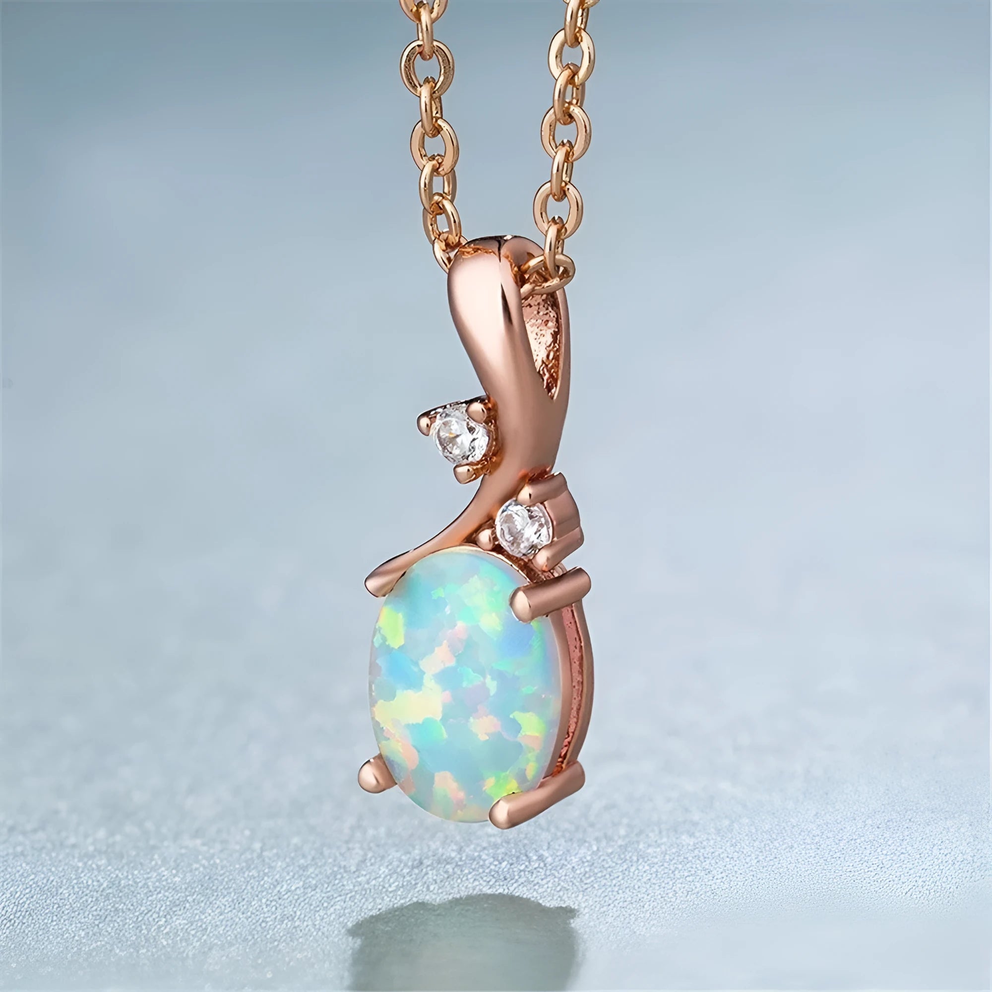 Water drop shaped opal pendant necklace with adjustable O-chain in white gold finish