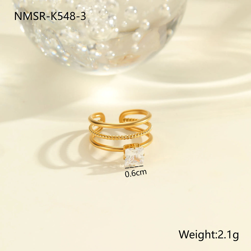 Gold inlaid zircon stainless steel ring with open mouth geometry heart drop design