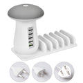 White USB charging dock station with 5 ports and a mushroom-shaped LED night lamp on a desk